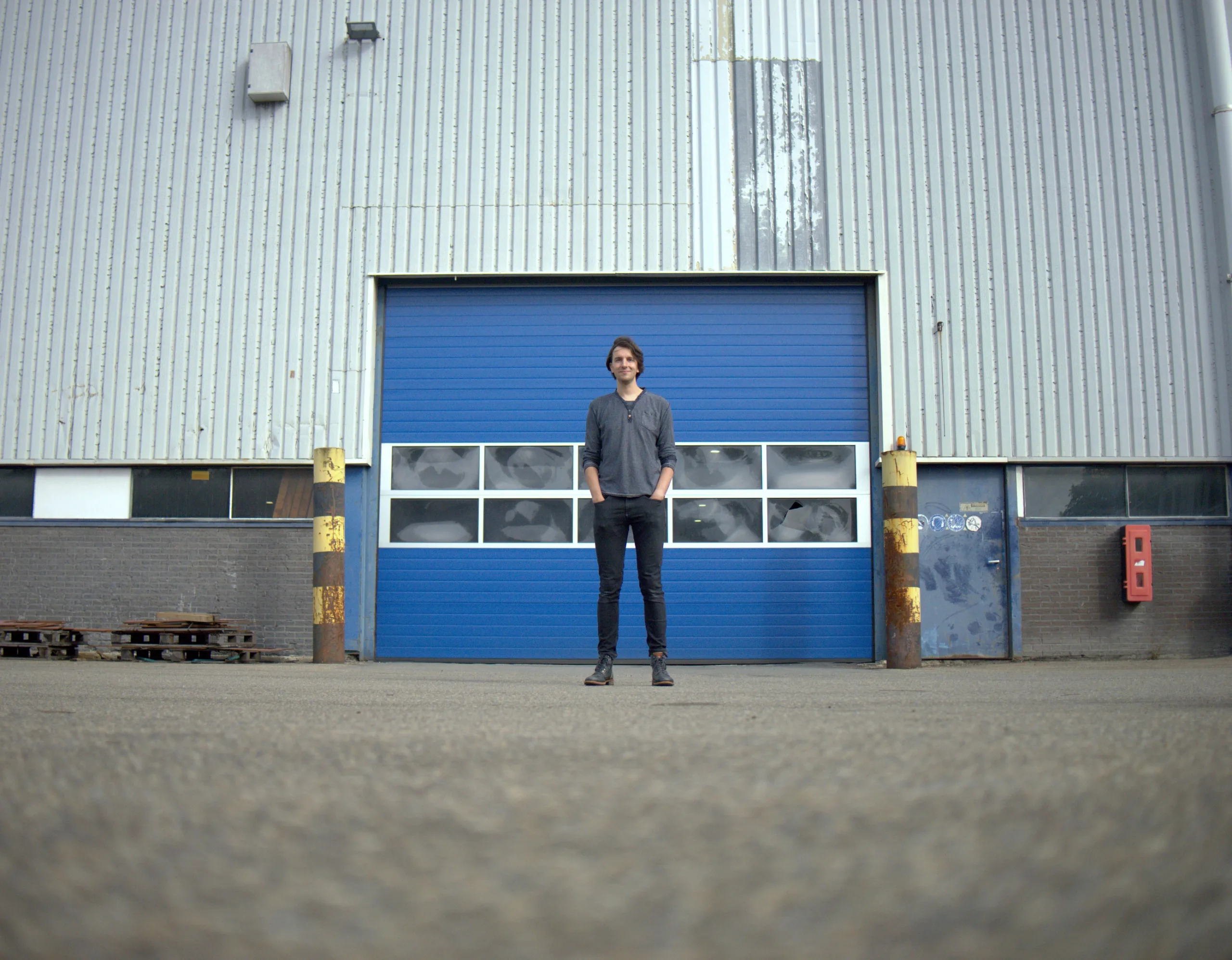 Harry standing in front of the DEKC workshop